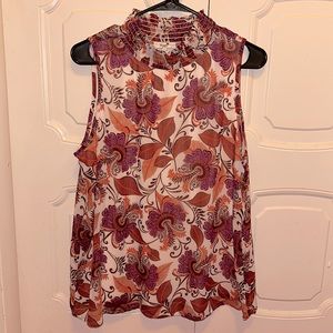 Sleeveless turtleneck blouse. Never worn.